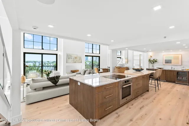 a large kitchen with stainless steel appliances lots of counter top space