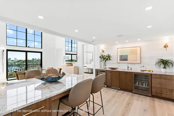 a kitchen with granite countertop a sink and cabinets