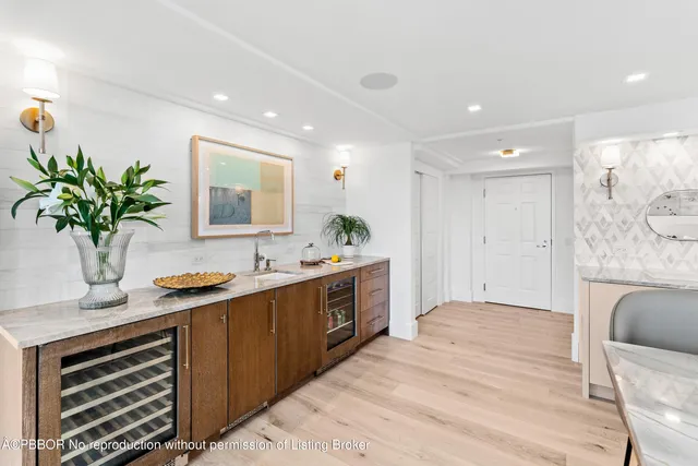 a spacious bathroom with a granite countertop sink a mirror and a shower