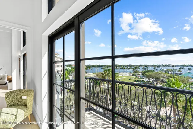 a view of a balcony with furniture