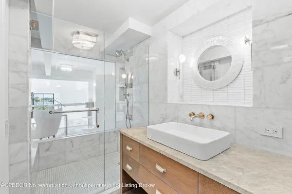 a bathroom with a sink and a mirror