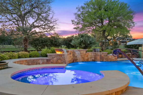 a view of a swimming pool with a patio