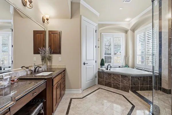 a bathroom with a sink double vanity and a mirror