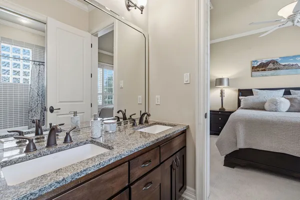 a bed room with a bed and a potted plant