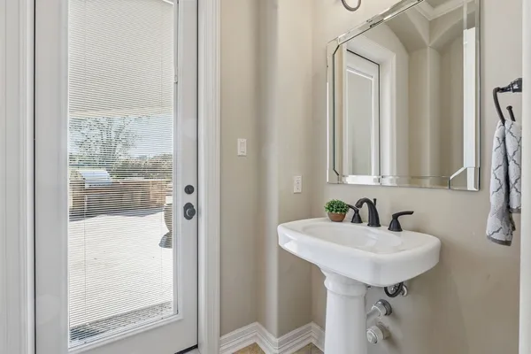 a white toilet sitting next to a bathtub