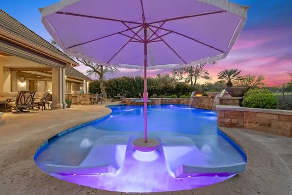 a view of a swimming pool with a patio