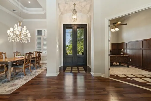 a view of a dining room with furniture window and wooden floor