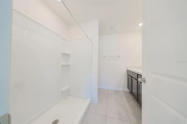a bathroom with a sink and a shower