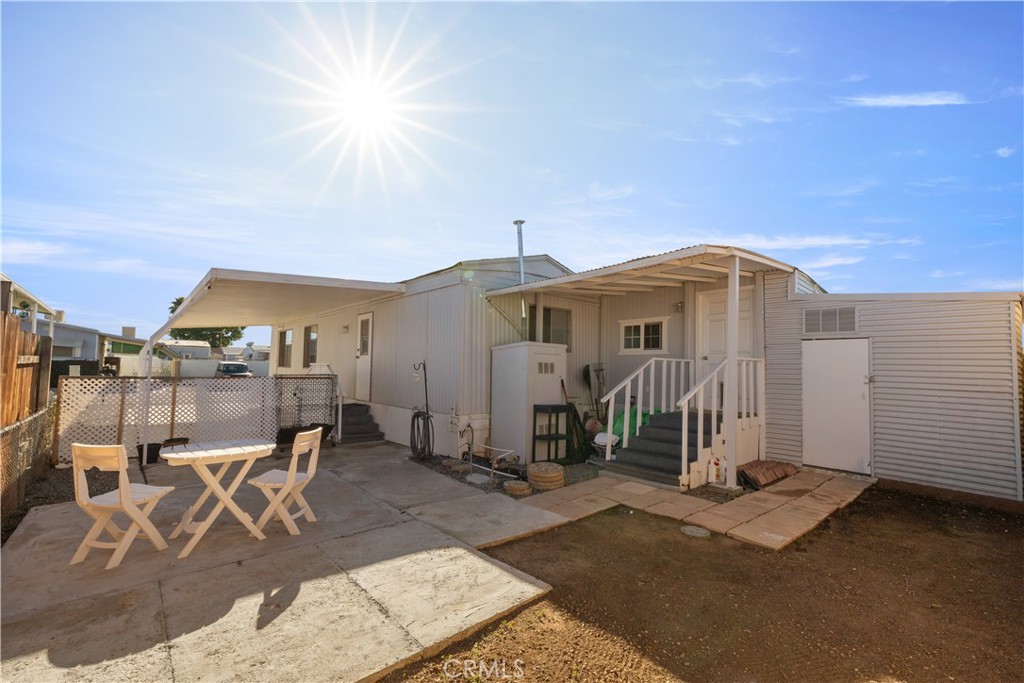 27150 Shadel Road, Unit 122 Menifee, CA 92586 - Photo 15 of 26 a front view of a house with a yard