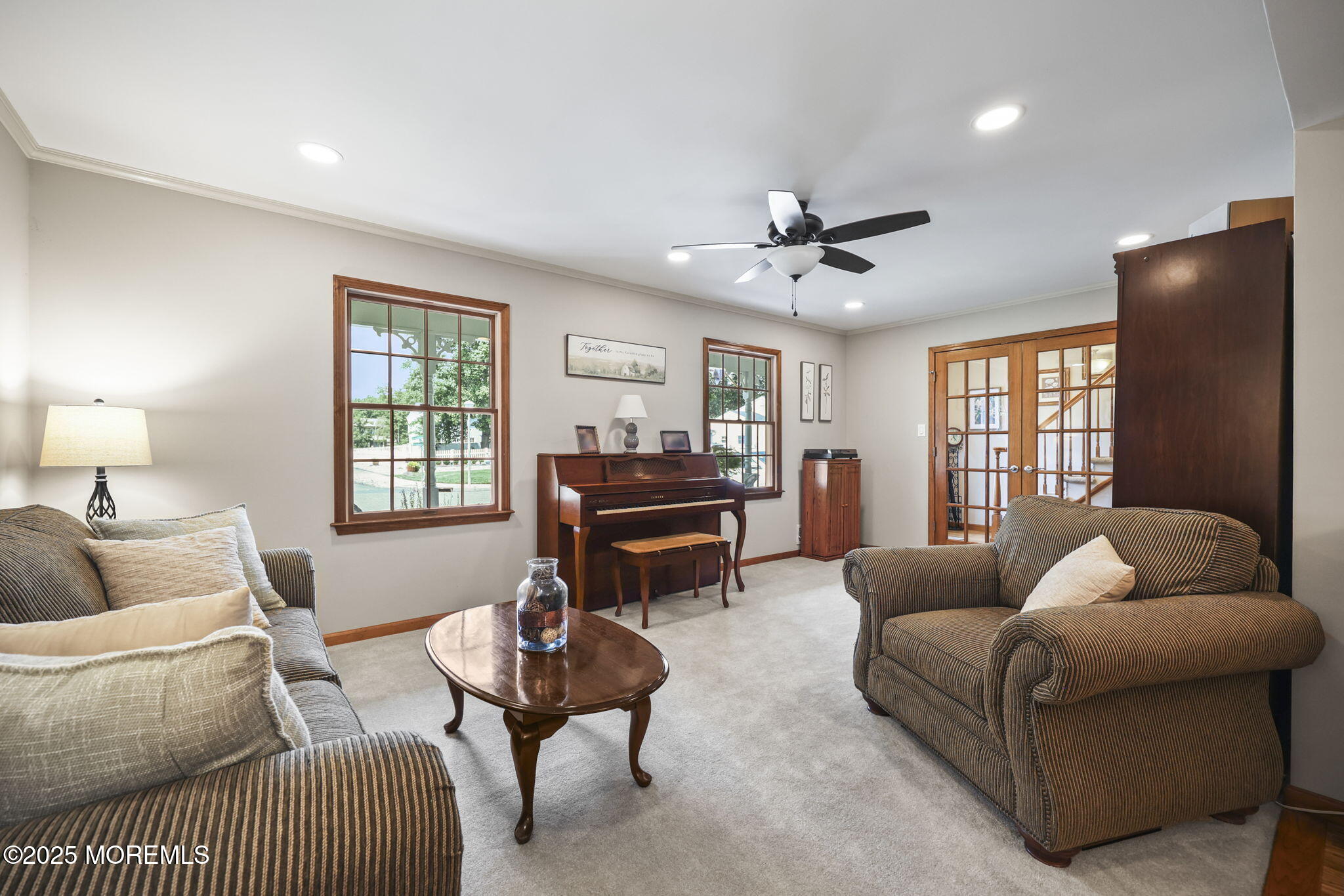 67 Appletree Road Howell, NJ 07731 - Photo 11 of 61 a living room with furniture a ceiling fan a window and a lamp