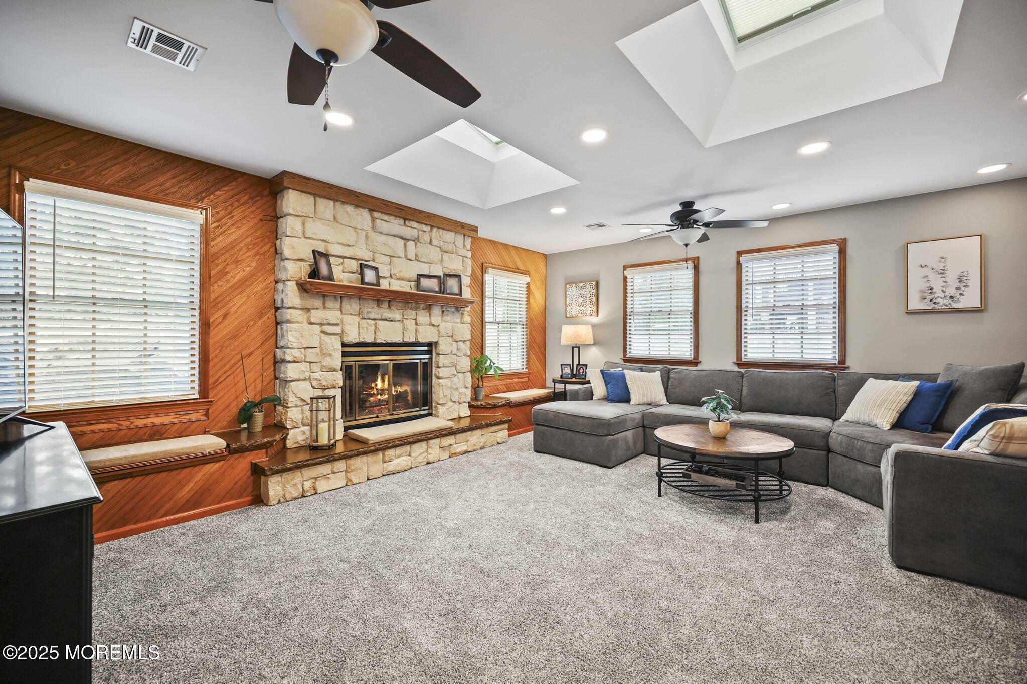 67 Appletree Road Howell, NJ 07731 - Photo 25 of 61 a living room with furniture and a fireplace
