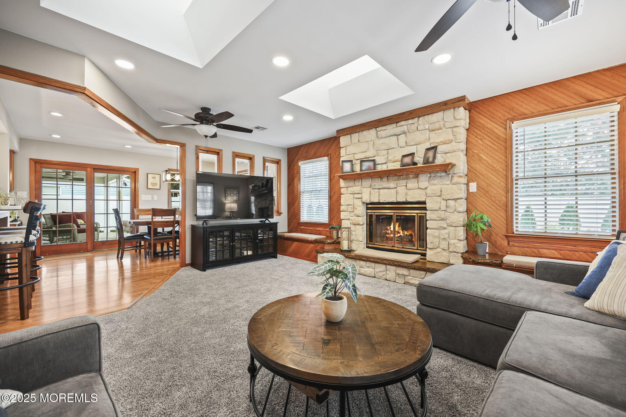 67 Appletree Road Howell, NJ 07731 - Photo 27 of 61 a living room with furniture a fireplace and a flat screen tv