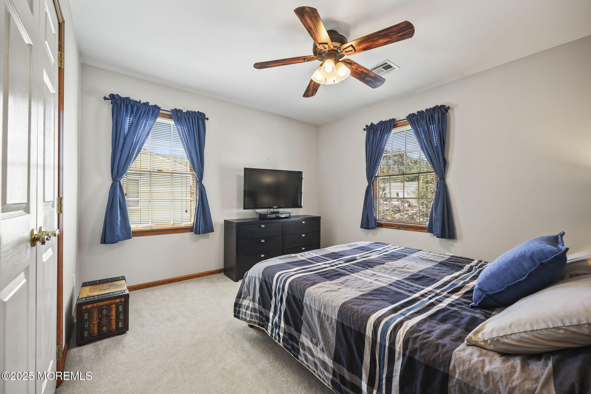 67 Appletree Road Howell, NJ 07731 - Photo 30 of 61 a bedroom with a bed and a tv on dresser