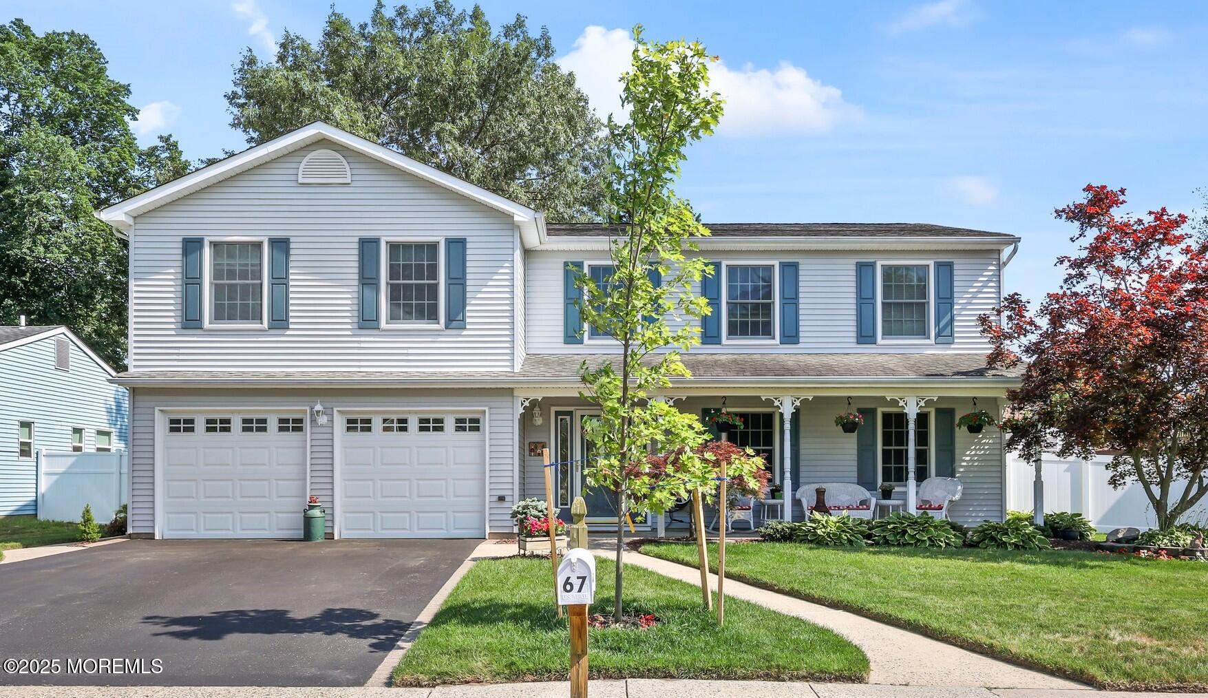 67 Appletree Road Howell, NJ 07731 - Photo 3 of 61 a front view of a house with a yard