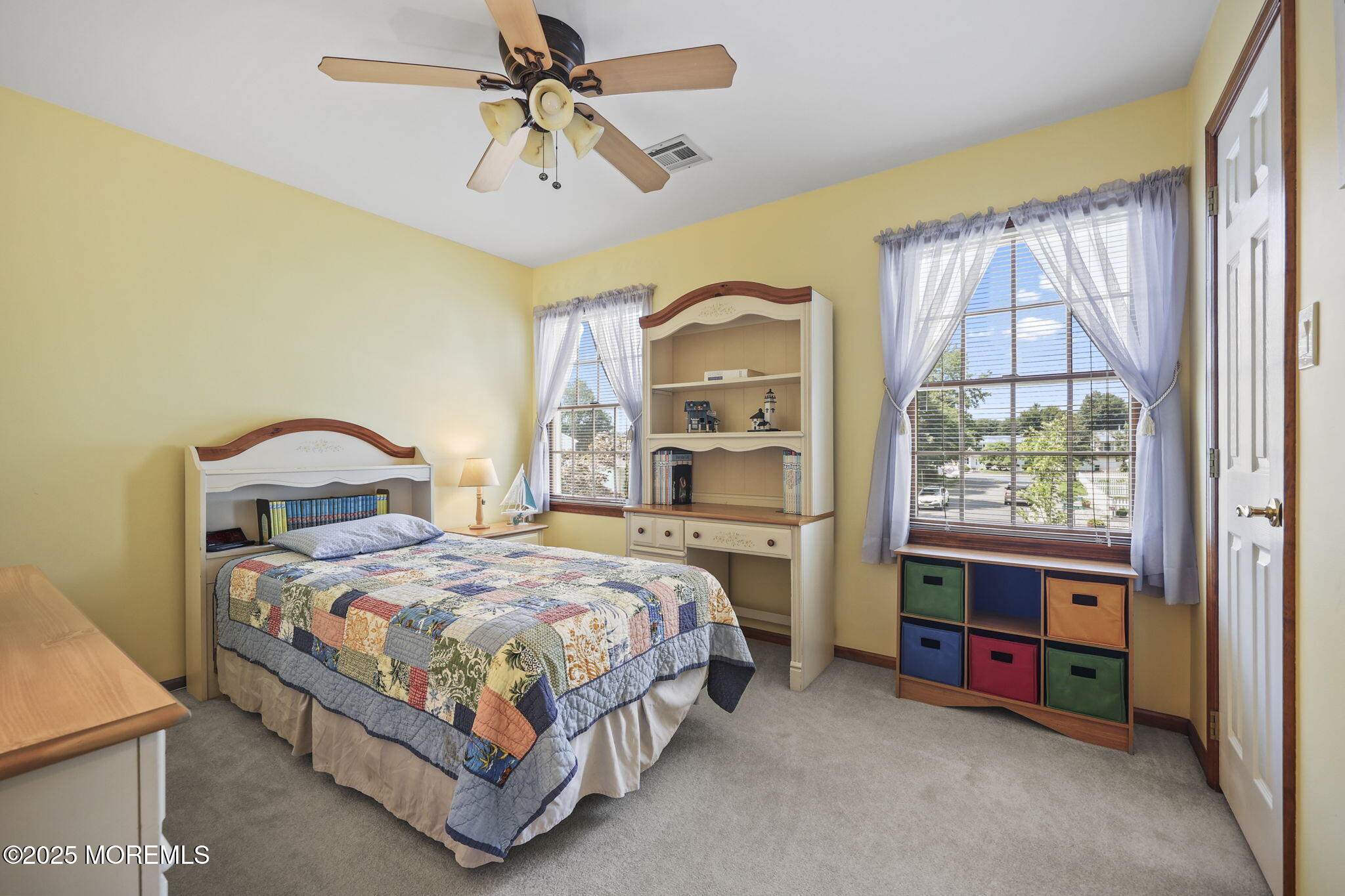 67 Appletree Road Howell, NJ 07731 - Photo 31 of 61 a bedroom with a bed and a chandelier