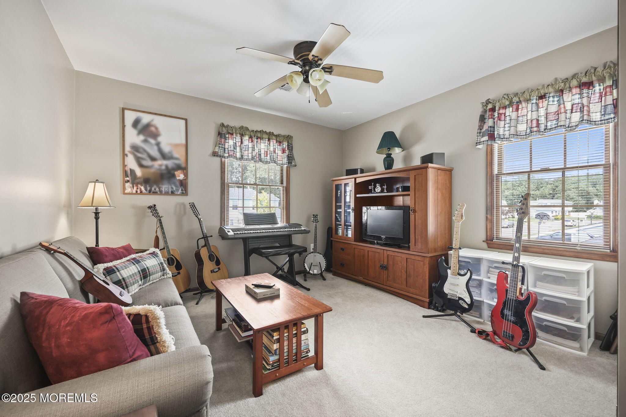 67 Appletree Road Howell, NJ 07731 - Photo 33 of 61 a living room with furniture and a flat screen tv