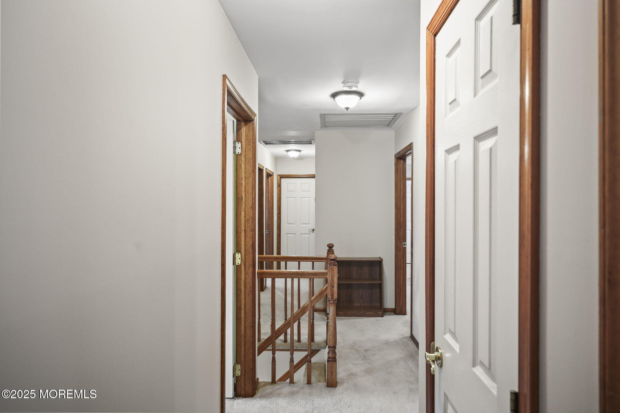 67 Appletree Road Howell, NJ 07731 - Photo 39 of 61 a view of a hallway with wooden floor and stairs