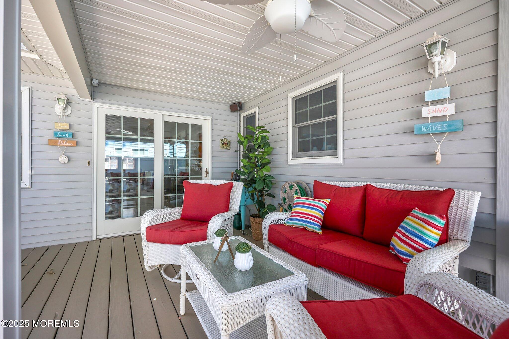 67 Appletree Road Howell, NJ 07731 - Photo 44 of 61 a view of a patio with couches chairs and wooden floor