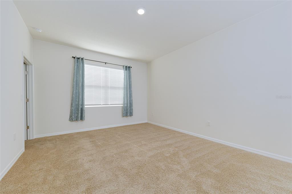 6264 Southwest 89th Ln Road Ocala, FL 34476 - Photo 17 of 22 an empty room with windows