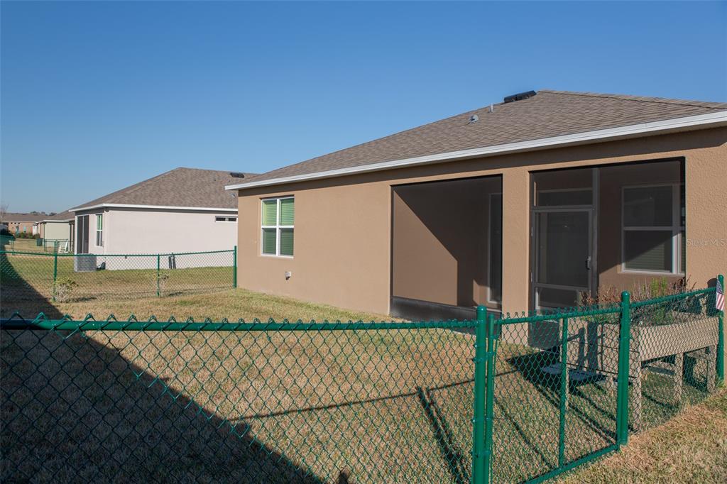 6264 Southwest 89th Ln Road Ocala, FL 34476 - Photo 2 of 22 front view of a house with a fence