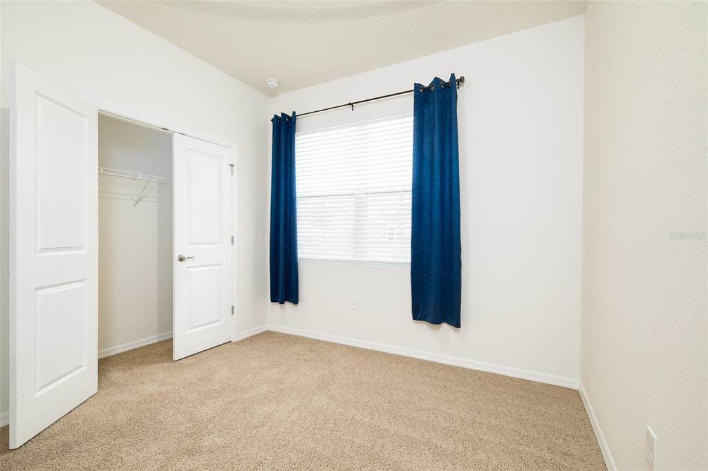 6264 Southwest 89th Ln Road Ocala, FL 34476 - Photo 5 of 22 an empty room with windows and closet