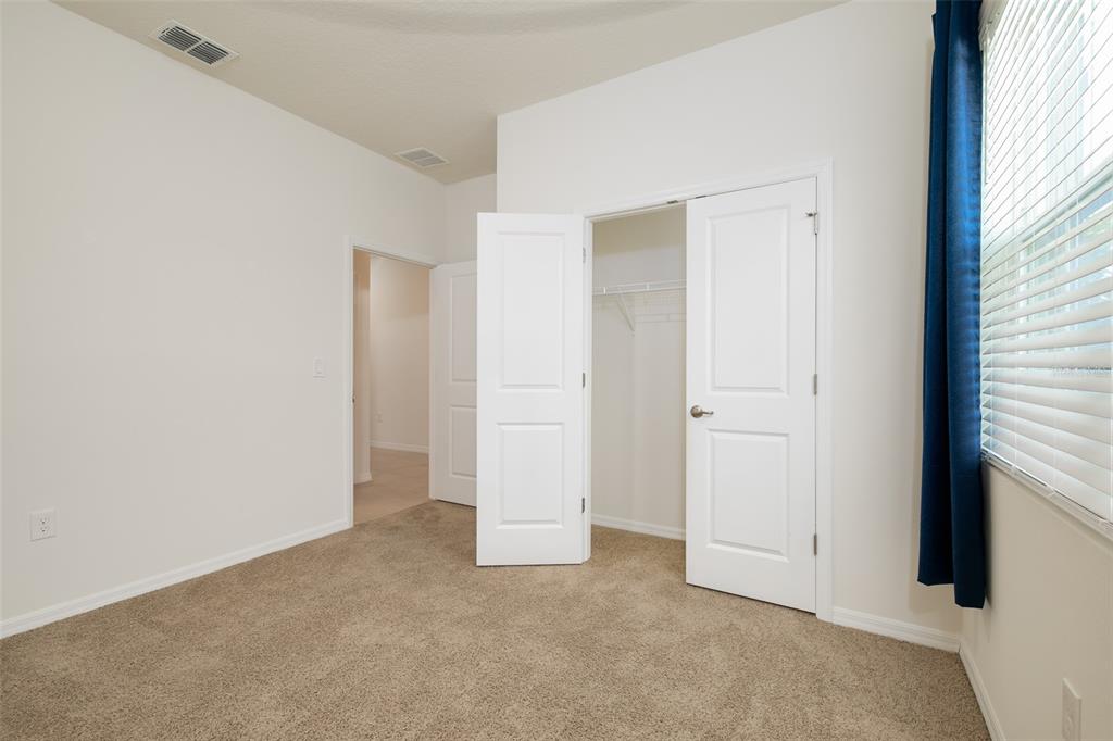 6264 Southwest 89th Ln Road Ocala, FL 34476 - Photo 6 of 22 an empty room with windows