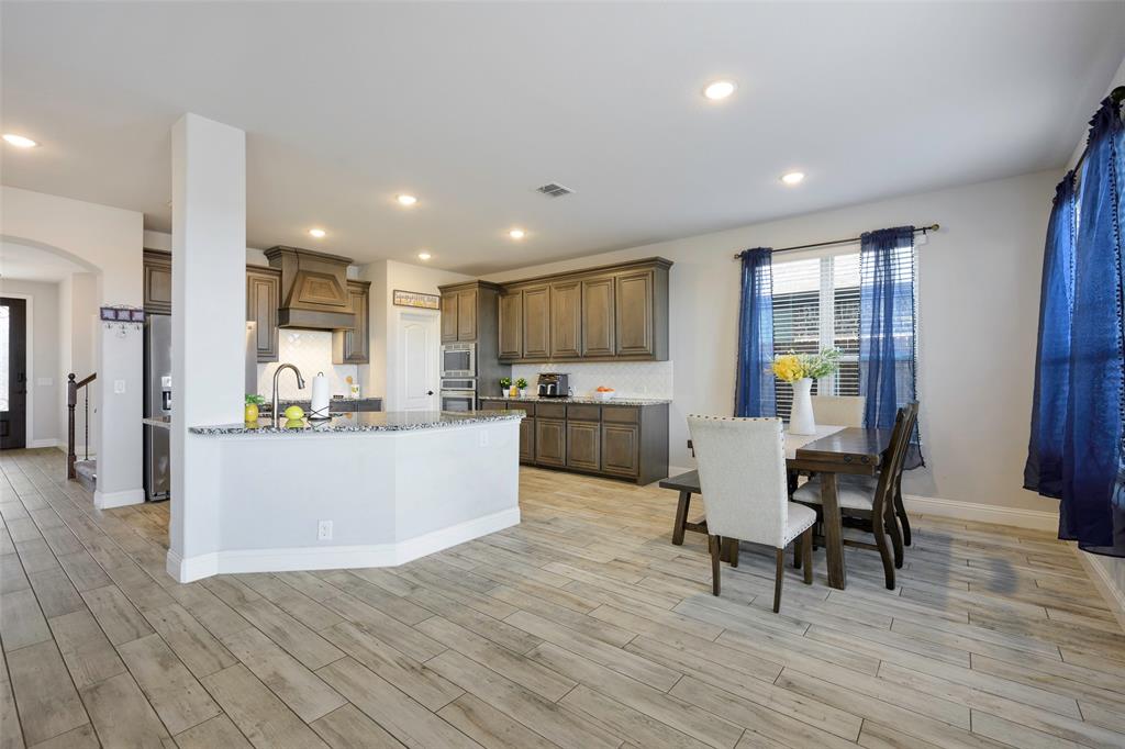 4059 Three Forks Road Kaufman, TX 75142 - Photo 8 of 25 a view of kitchen with granite countertop lots of counter top space and stainless steel appliances