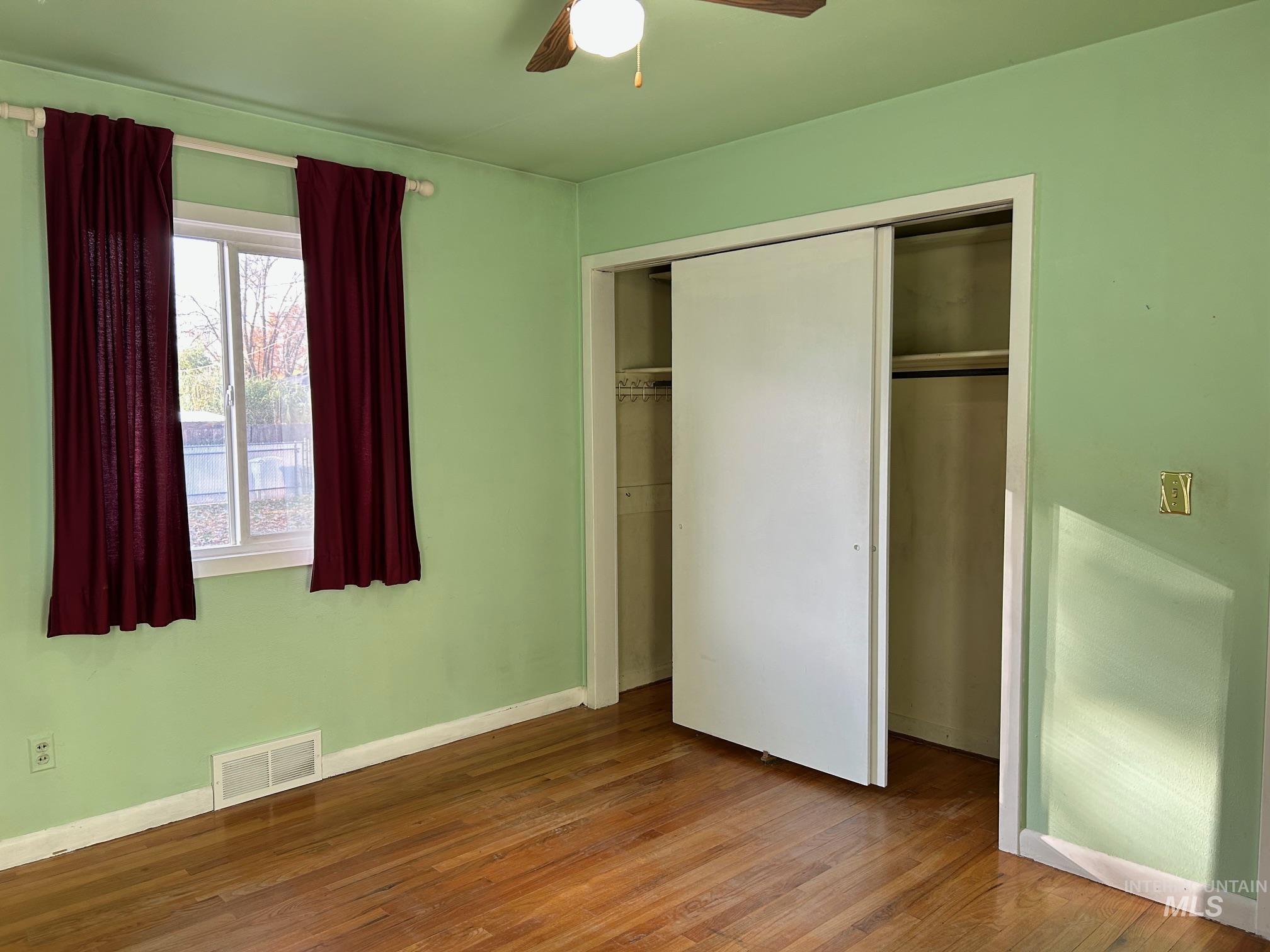 112 17th Avenue Lewiston, ID 83501 - Photo 22 of 40 Bedroom with wood finished floors, a closet, and a ceiling fan