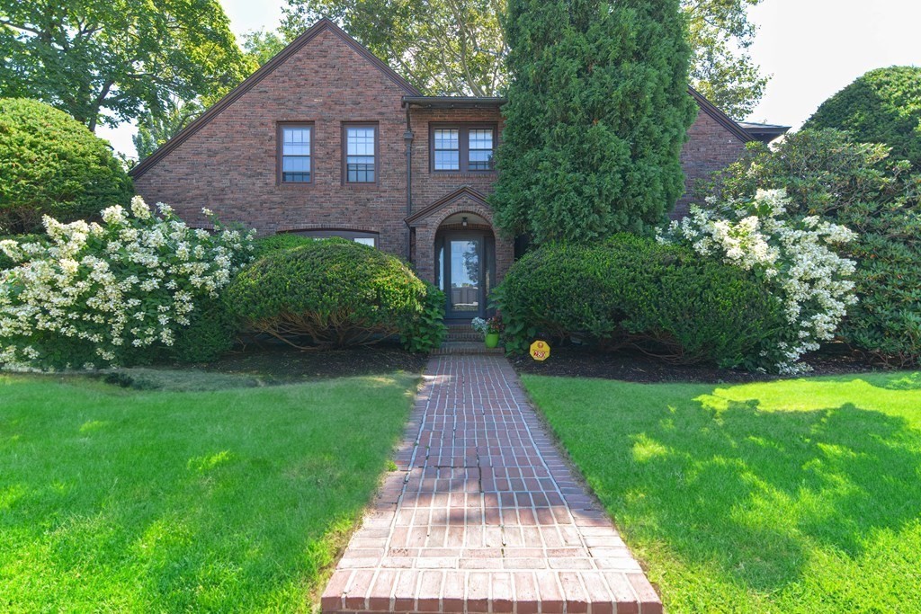 280 Common Street Belmont, MA 02478 - Photo 1 of 36 a front view of a house with a yard and garden