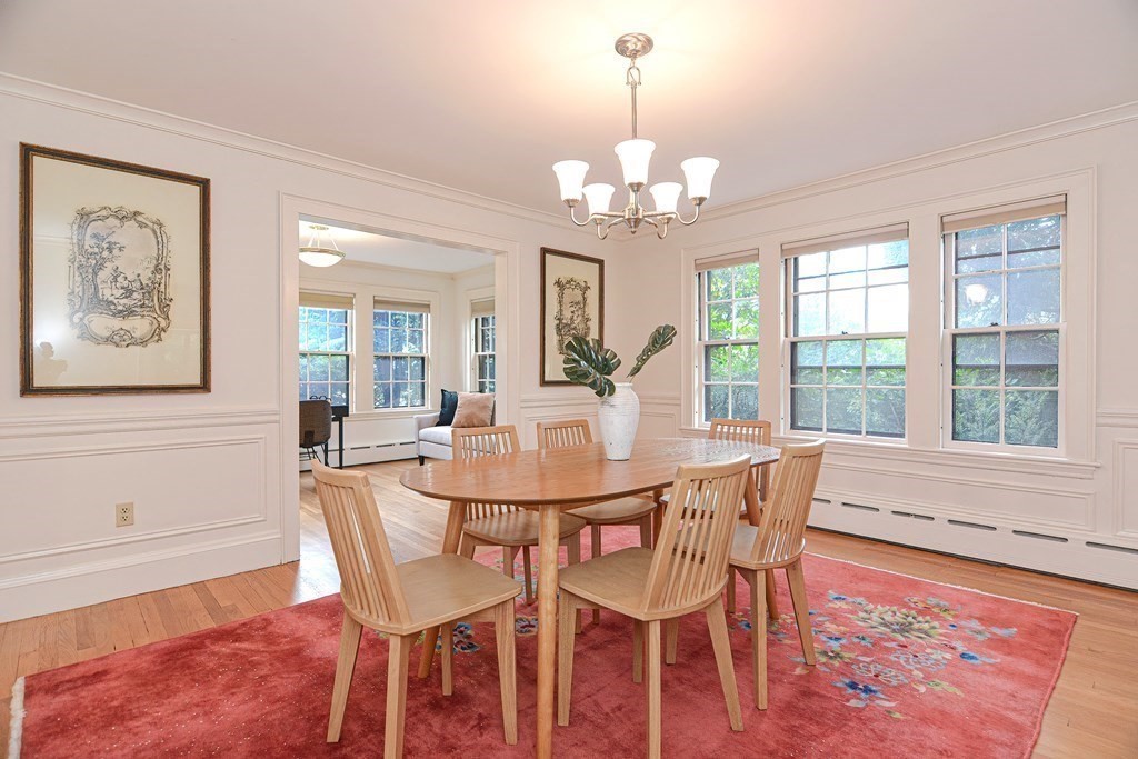280 Common Street Belmont, MA 02478 - Photo 11 of 36 a view of a dining room with furniture a chandelier and wooden floor