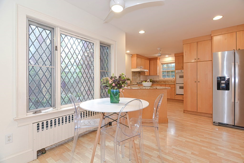 280 Common Street Belmont, MA 02478 - Photo 14 of 36 a dining room with furniture a chandelier and wooden floor
