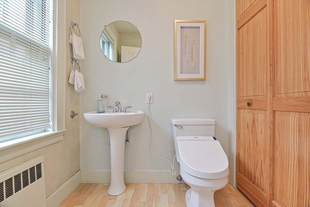 280 Common Street Belmont, MA 02478 - Photo 16 of 36 a bathroom with a toilet a sink and a mirror