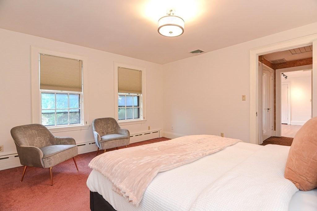 280 Common Street Belmont, MA 02478 - Photo 20 of 36 a bedroom with two beds and a chair