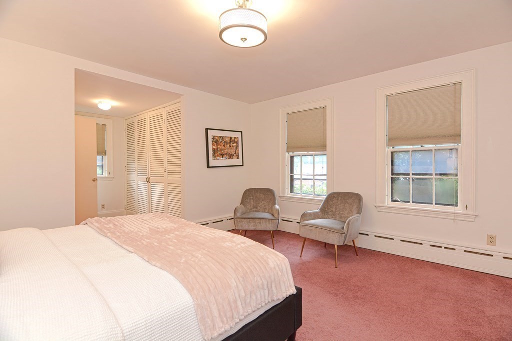 280 Common Street Belmont, MA 02478 - Photo 21 of 36 a spacious bedroom with a bed and a large window