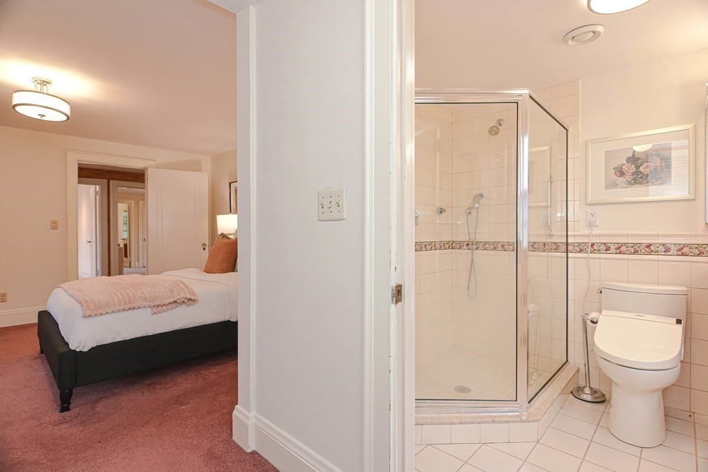 280 Common Street Belmont, MA 02478 - Photo 22 of 36 a en suite bathroom with a toilet a sink and mirror