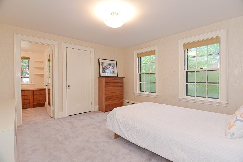280 Common Street Belmont, MA 02478 - Photo 24 of 36 a spacious bedroom with a bed and a window