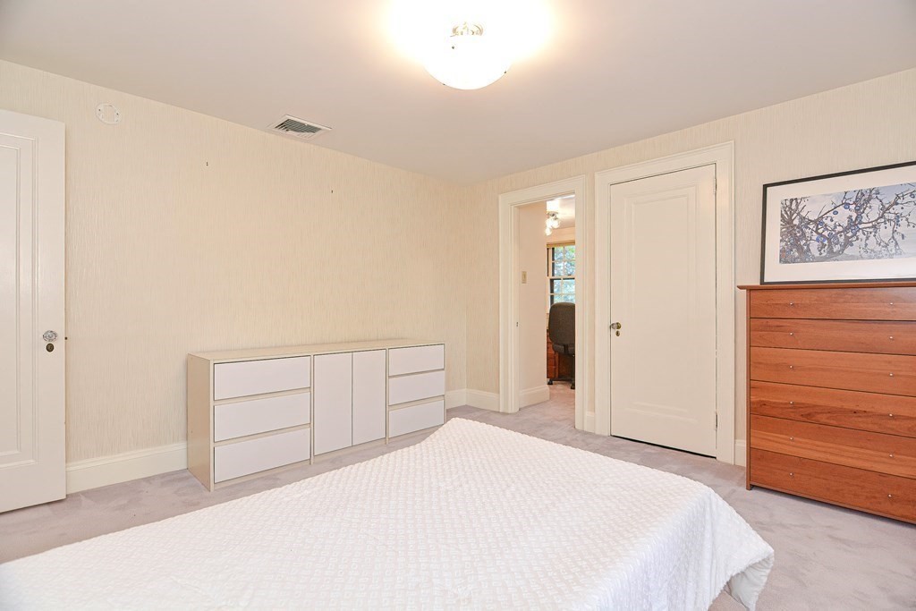 280 Common Street Belmont, MA 02478 - Photo 25 of 36 a bedroom with a bed and a dresser
