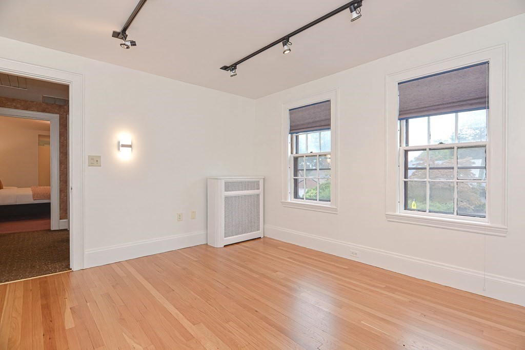 280 Common Street Belmont, MA 02478 - Photo 27 of 36 a view of empty room with wooden floor and fan