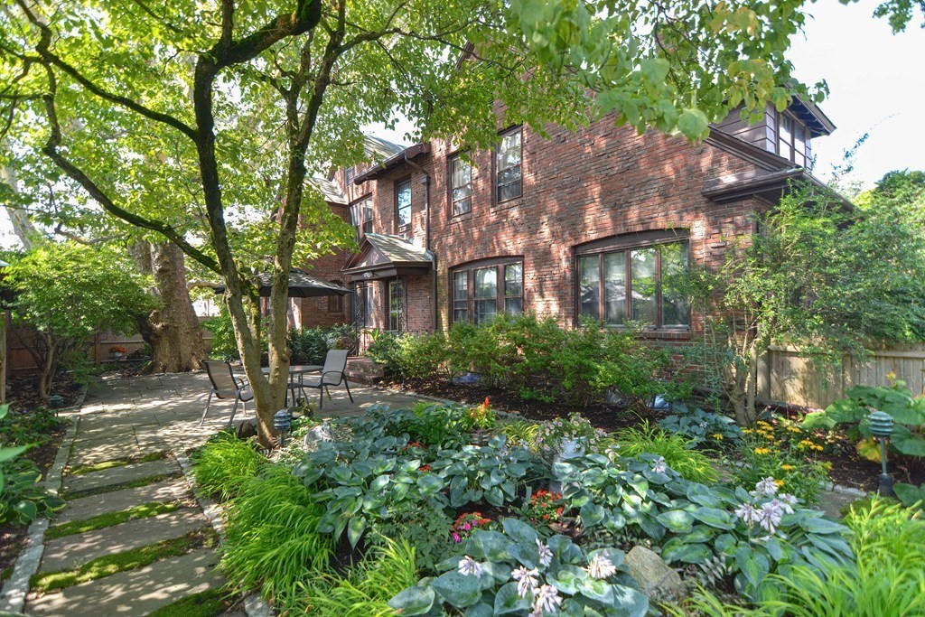280 Common Street Belmont, MA 02478 - Photo 33 of 36 a front view of a house with lots of green space