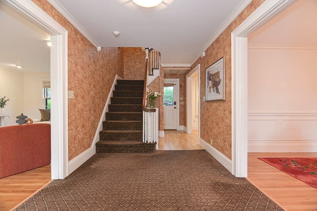 280 Common Street Belmont, MA 02478 - Photo 5 of 36 a view of a hallway with staircase
