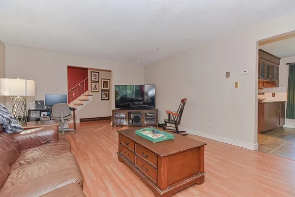a kitchen with stainless steel appliances a refrigerator sink and cabinets