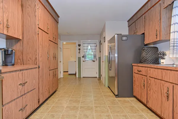 a kitchen with stainless steel appliances a sink stove and cabinets