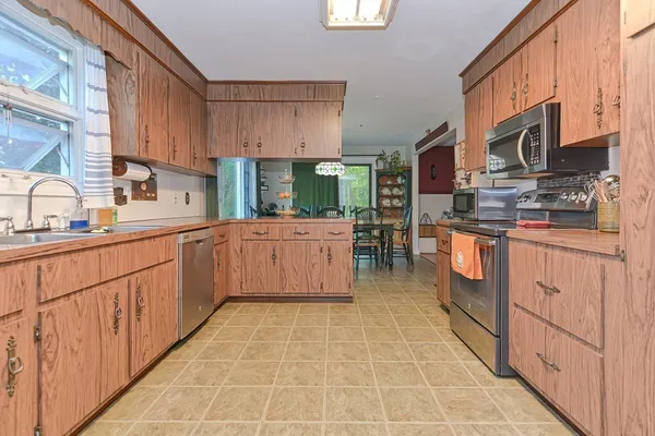 a view of a dining room with furniture window and outside view