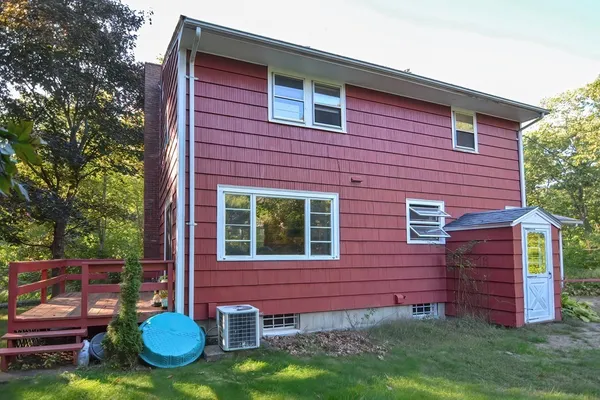 a view of front door of house with yard