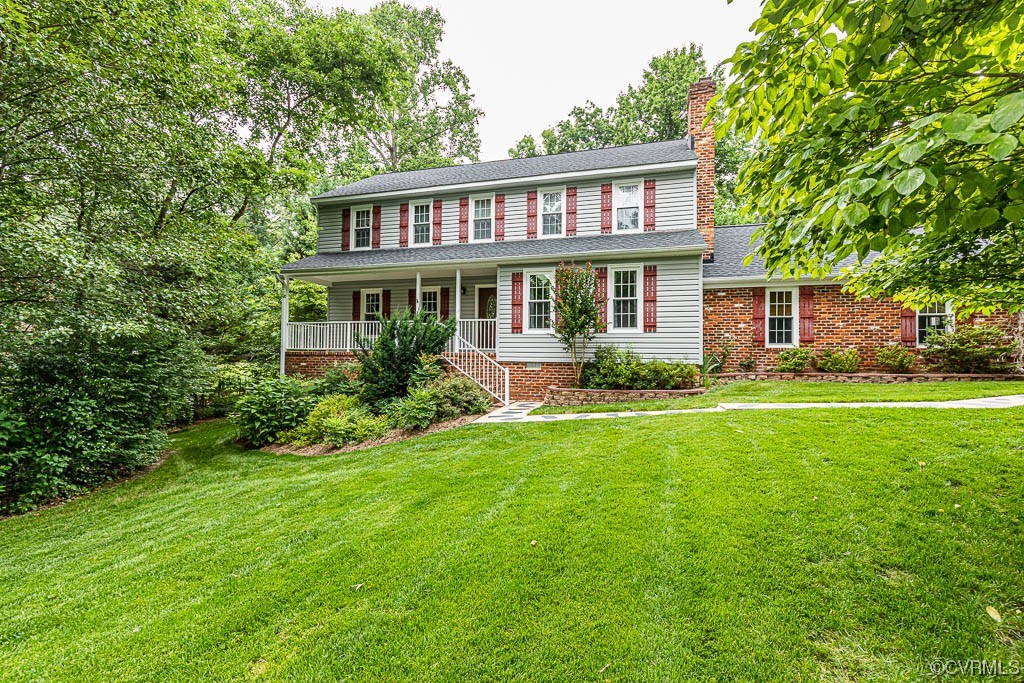 3400 Wood Dale Road Chester, VA 23831 - Photo 1 of 32 a front view of a house with a garden