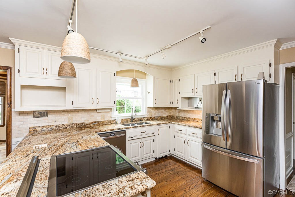 3400 Wood Dale Road Chester, VA 23831 - Photo 14 of 32 a kitchen with stainless steel appliances granite countertop a refrigerator a sink dishwasher a stove and white cabinets with wooden floor