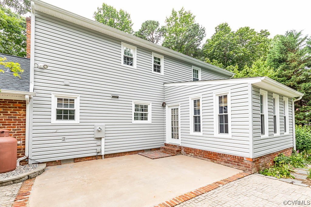 3400 Wood Dale Road Chester, VA 23831 - Photo 2 of 32 a backyard of a house with potted plants and seating space