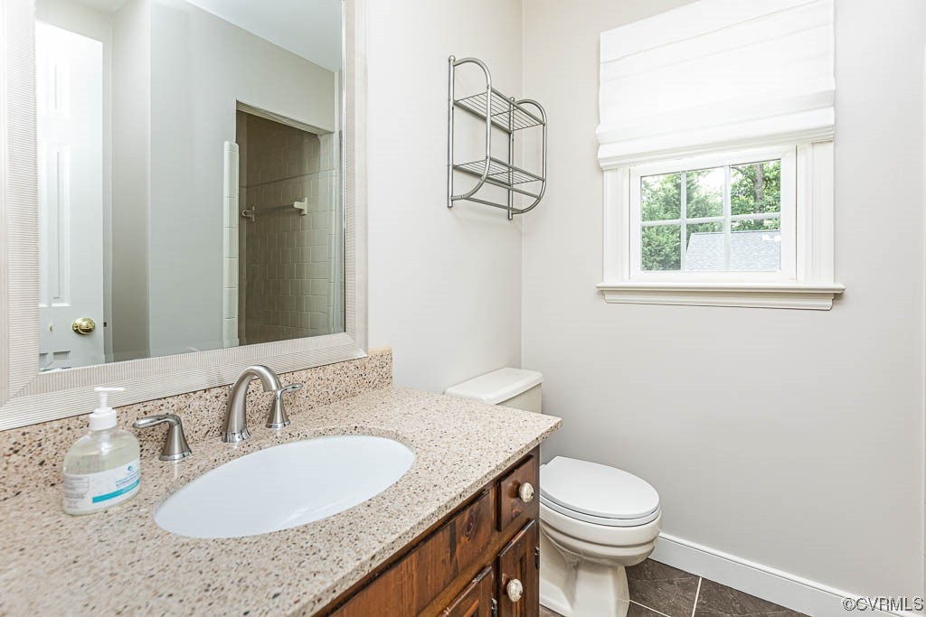 3400 Wood Dale Road Chester, VA 23831 - Photo 23 of 32 a bathroom with a granite countertop sink and a mirror