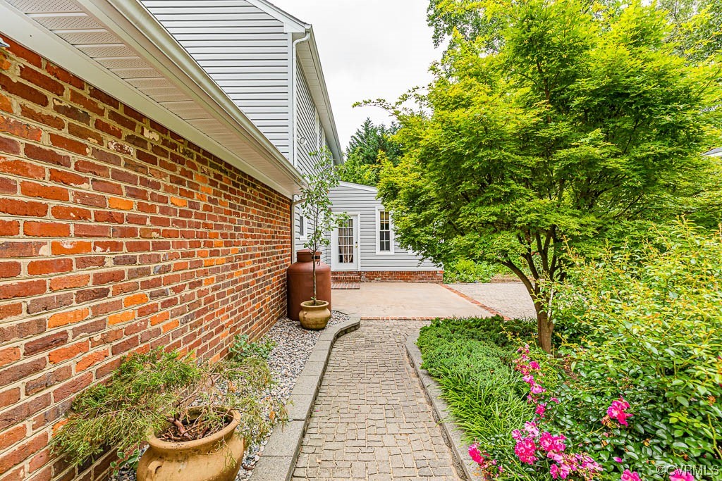 3400 Wood Dale Road Chester, VA 23831 - Photo 7 of 32 a view of a back yard with potted plants