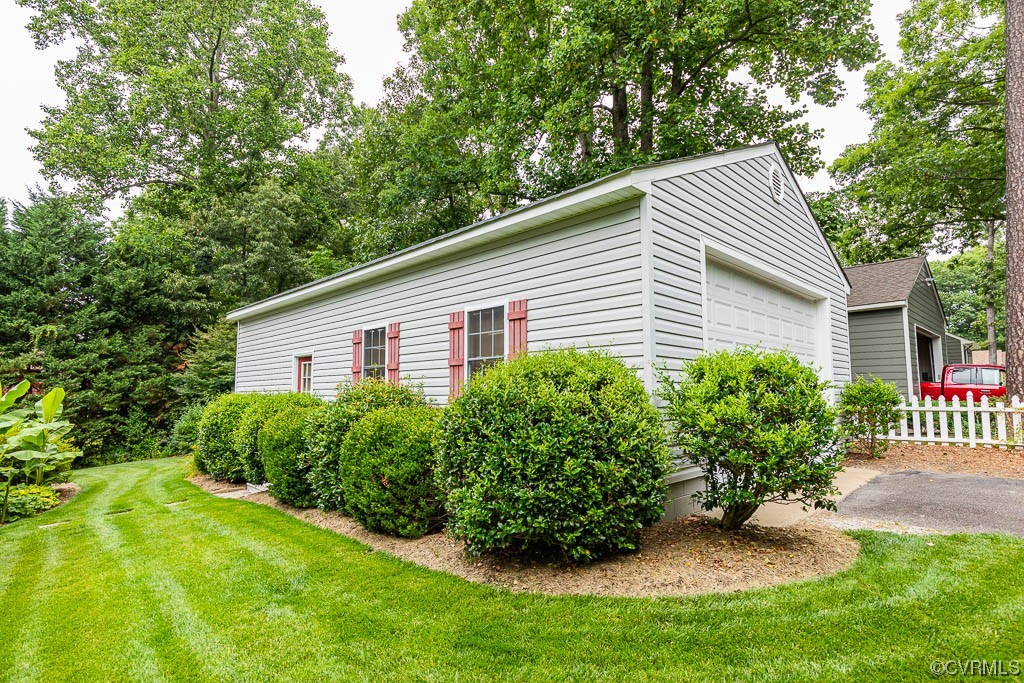 3400 Wood Dale Road Chester, VA 23831 - Photo 8 of 32 a view of a house with a yard and a garden